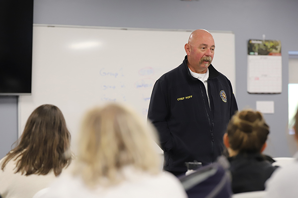 Firefighter Chief speaking to a class